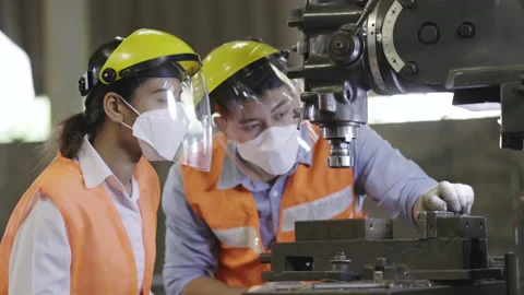 Team Asian machine engineers is providing maintenance services for machines Stock-Footage 150960788