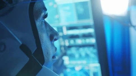 Team of astronauts in a space suits aboard the orbital station. A crew of Stock Footage 229790746