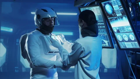 Team of astronauts in a space suits aboard the orbital station. A crew of Stock Footage 231901137