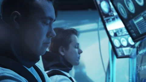 Team of astronauts in a space suits aboard the orbital station. A crew of Stock Footage 237101566