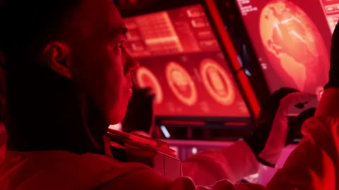 Team of astronauts in a space suits aboard the Mars station. A crew of Stock Footage 259386989