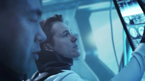 Team of astronauts in a space suits aboard the orbital station. A crew of Stock Footage 259388882