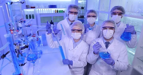 Team of Biochemists Posing Looking Camera Holding Glassware Research Laboratory Stock Footage 85483791