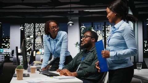 Team of black colleagues doing teamwork on a project with financial forecasting Stock Photos