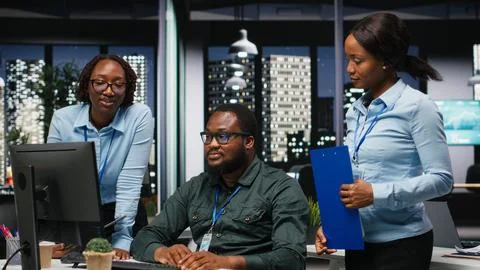 Team of black colleagues doing teamwork on a project with financial forecasting Stock Photos