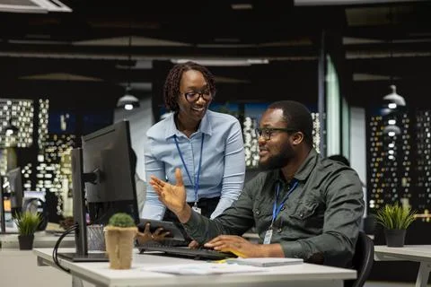 Team of black colleagues doing teamwork on a project with financial forecasting Stock Photos