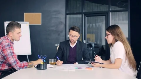 Team brainstorming process. coworkers discussing new ideas modern office Stock Footage 80326045