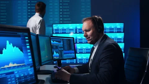 Team of brokers is working in office using workstation and analysis technology Stock Footage 145201709