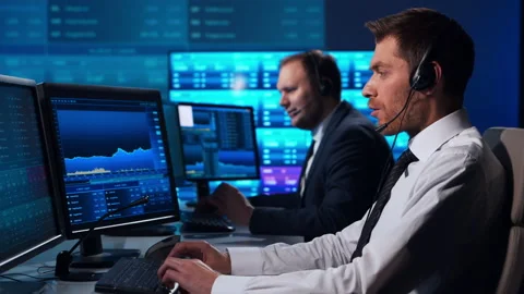 Team of brokers is working in office using workstation and analysis technology Stock Footage 145829537