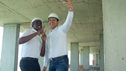 Team of builders happy smiling take selfie photo during meeting on construction Stock Footage 82802374