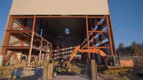 Team of builders is working on the foundation of the future factory workshop Stock Footage 161957330