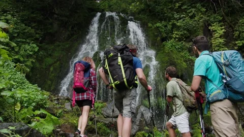 Team building, rest with colleagues in mountains. Group of tourists watching Stock Footage 208891249