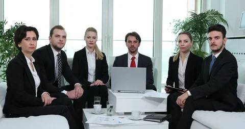 Team of Business People Presentation Camera Confident Look in Office Sit on Sofa Stock Footage 87885079