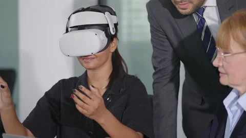 Team of business using VR technology for planning strategy analysis of company Stock Footage 241385224