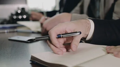 A team of businessmen is preparing to record important information. Stock Footage 89668362