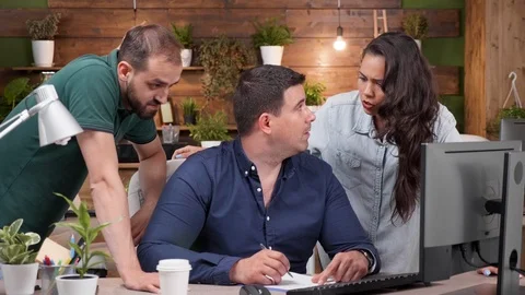 Team of businesspersons talkign and debating Stock Footage 112653693