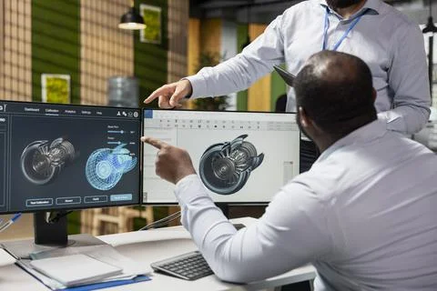 Team of CAD engineers doing brainstorming to upgrade turbine Stock Photos