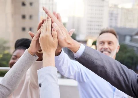 This team is capable of anything. a diverse group of businesspeople huddled Stock Photos