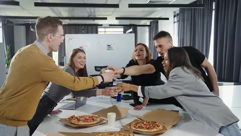 The team celebrates the successful start of the project during the lunch break Stock Footage 193974352