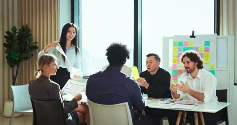 Team celebrating creative presentation success Stock Footage 306095504