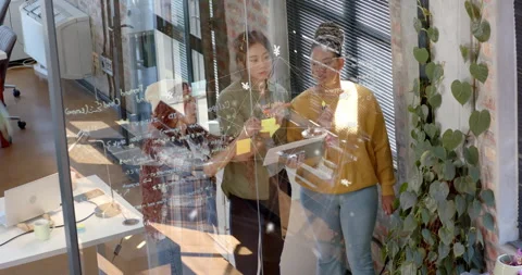 Team checking smartphone and tablet driving business planning by adding sticky 库存影片 316133610