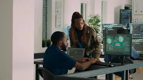 Team of coders writing data and encountering system crash 스톡 사진