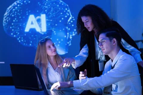 Team collaborates on artificial intelligence project in modern workspace wi.. Stock Photos