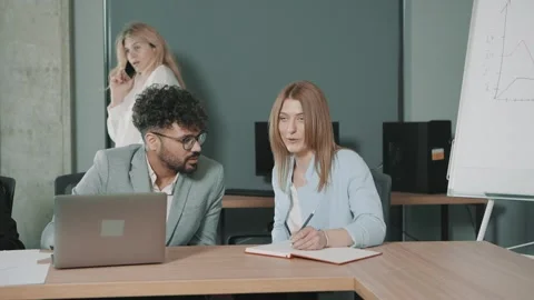 Team collaborates in an office Video stock 312259591