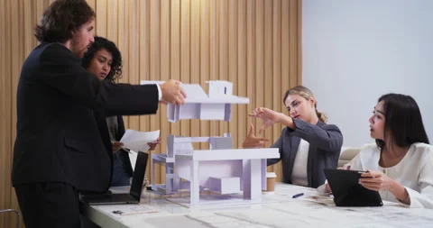 Team collaborating on architectural model design Stock Footage 306090265