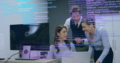 Team collaborating around desk with laptop in tech workspace, with code overlay Stock Footage 307440044