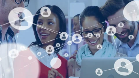 Team collaborating around laptop, displaying network connection icons for Stock Footage 308602829