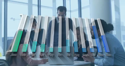 Team collaborating around modern conference table, displaying finance bar chart Stock Footage 307434607