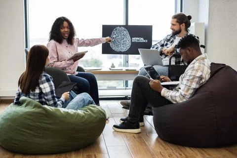 Team collaborating on artificial intelligence project in office 스톡 사진