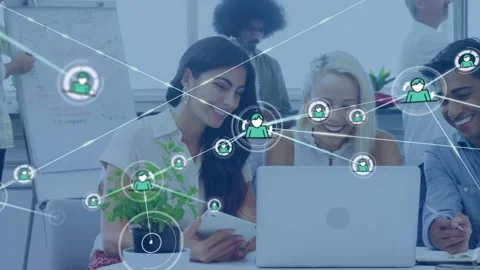 Team collaborating at laptop while green network overlay appearing, expanding to Stock Footage 334112488