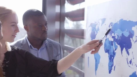Team collaborating organizing an international project at the office Stock Footage 73868724