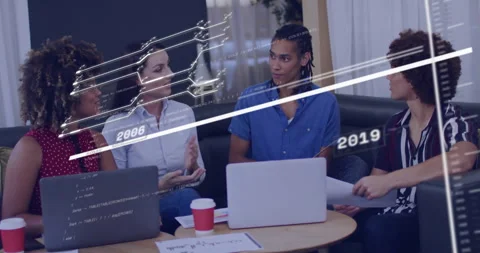 Team collaborating over laptops in tech hub, displaying floating code snippets Stock Footage 307432484