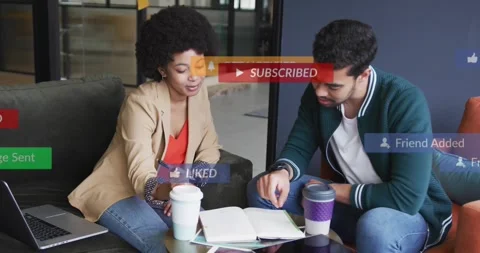 Team collaborating over notebook in education UI overlays appearing over pair, Stock Footage 334115253