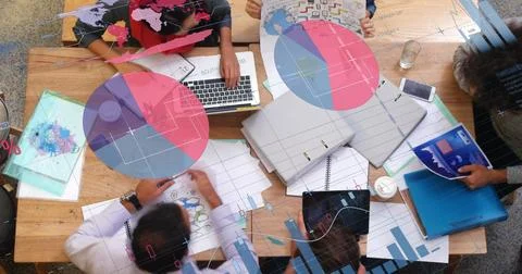 Team collaborating on project with laptops and documents at modern office desk Illustrazione stock
