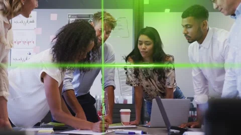 Team collaborating at table, curly-haired woman starting writing, coworkers Stock Footage 333949659