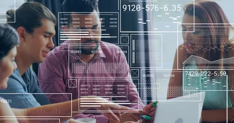 Team collaborating at table, pointing laptop screen, with floating code and Stock Footage 309144657