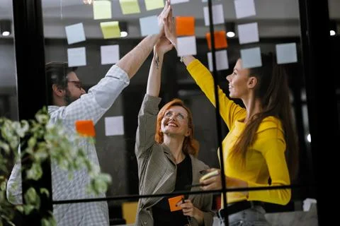 Team collaboration and brainstorming session with colorful sticky notes in a Stock Photos