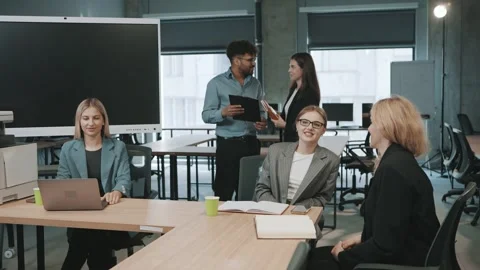 Team collaboration and document review in a modern office setting Video stock 312258466