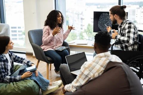 Team collaboration on artificial intelligence project with a diverse group Stock Photos
