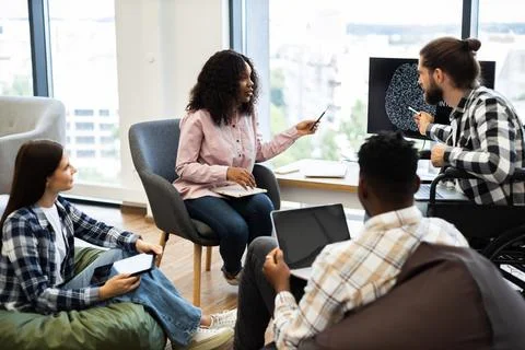 Team collaboration on artificial intelligence project with a diverse group Stock Photos