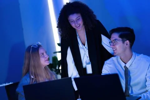 Team collaboration in a modern workspace during an evening brainstorming se.. Stock Photos