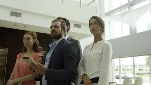 Team of colleagues in lobby, portrait Stock Footage 75176406