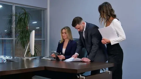 Team of colleagues working together on a project Stock Footage 76110701