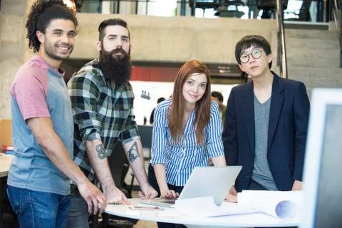 Team of colleagues working together on project in office Stock Photos