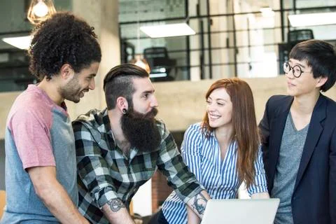 Team of collegues collaborating in office Stock Photos