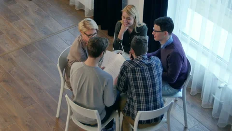 Team communication, group of five people discussing something with smile while 스톡 동영상 119193974